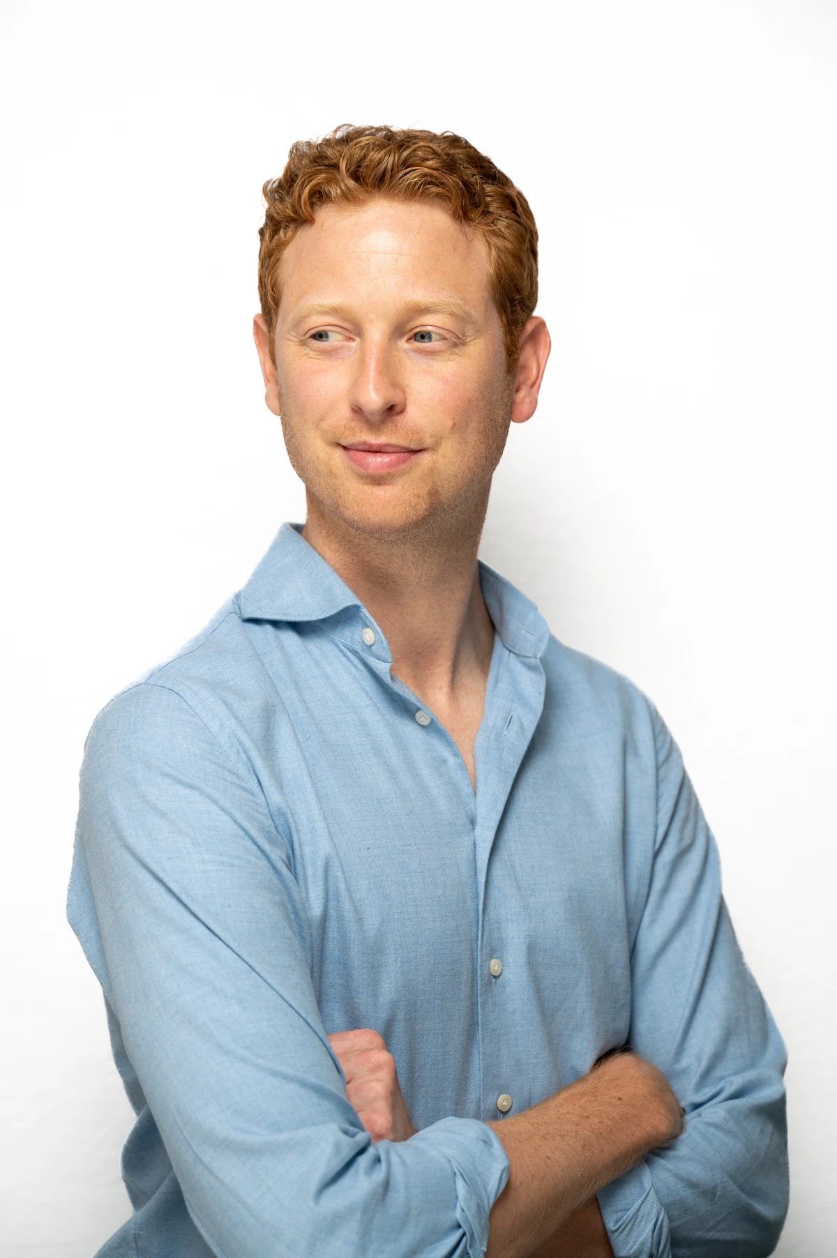 A Visory team member in a blue shirt looks to the side.