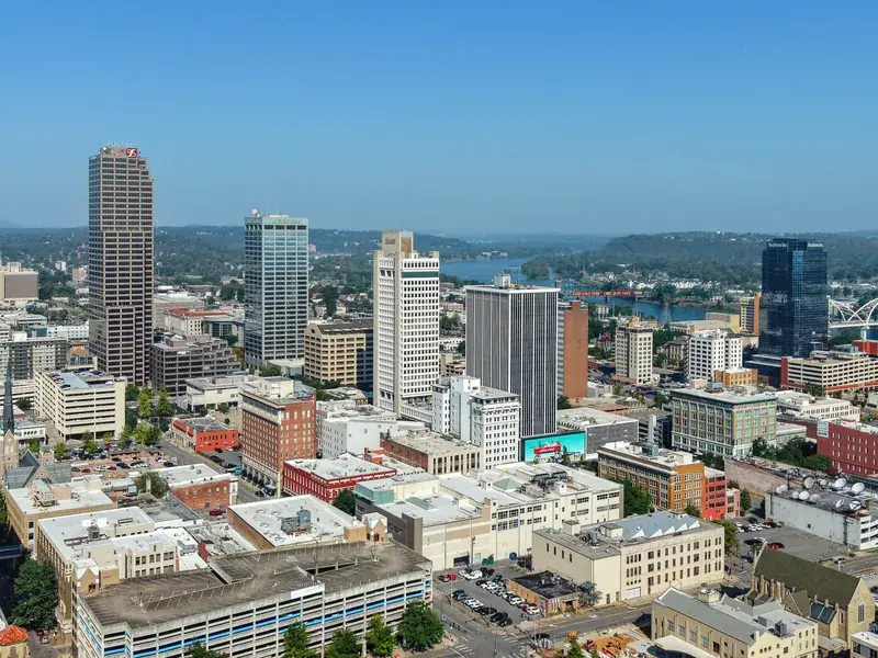 Downtown Little Rock’s towers from above, with the Arkansas River and its bridges beyond.