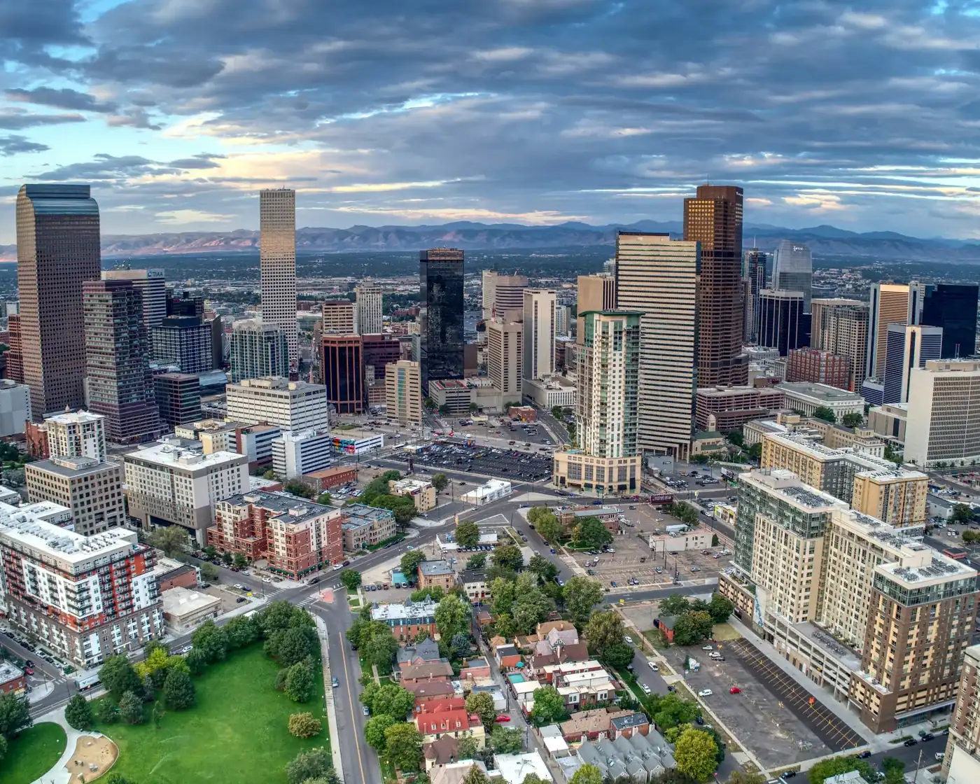 Downtown Denver from the air, with the Rocky Mountains on the horizon.