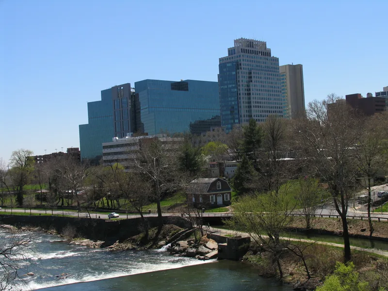 Wilmington’s downtown office towers above the Brandywine Creek and its old millrace on a spring day.