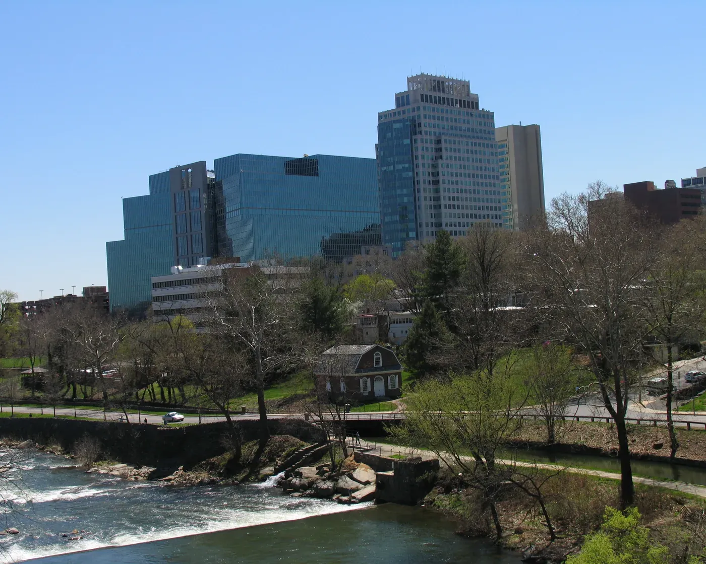 Wilmington’s downtown office towers above the Brandywine Creek and its old millrace on a spring day.