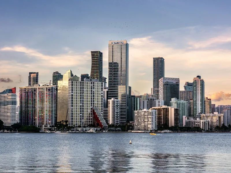 Miami’s Brickell skyline across Biscayne Bay in late-afternoon light.
