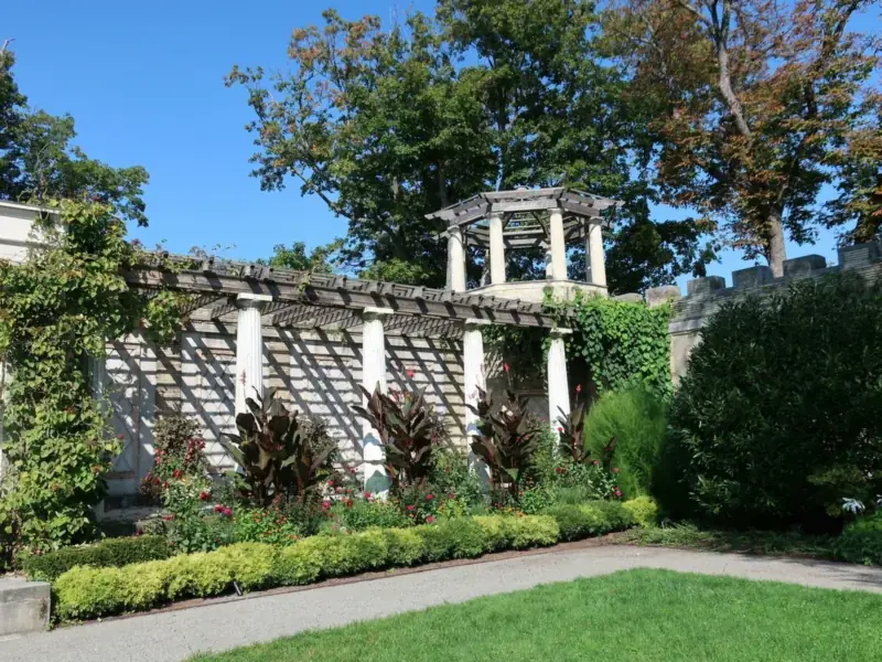 The pergola and planted beds of Untermyer Park and Gardens in Yonkers on a sunny day.