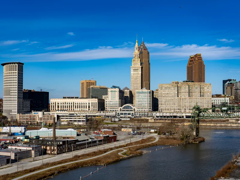 Downtown Cleveland and Terminal Tower above the Cuyahoga River on a clear winter day.