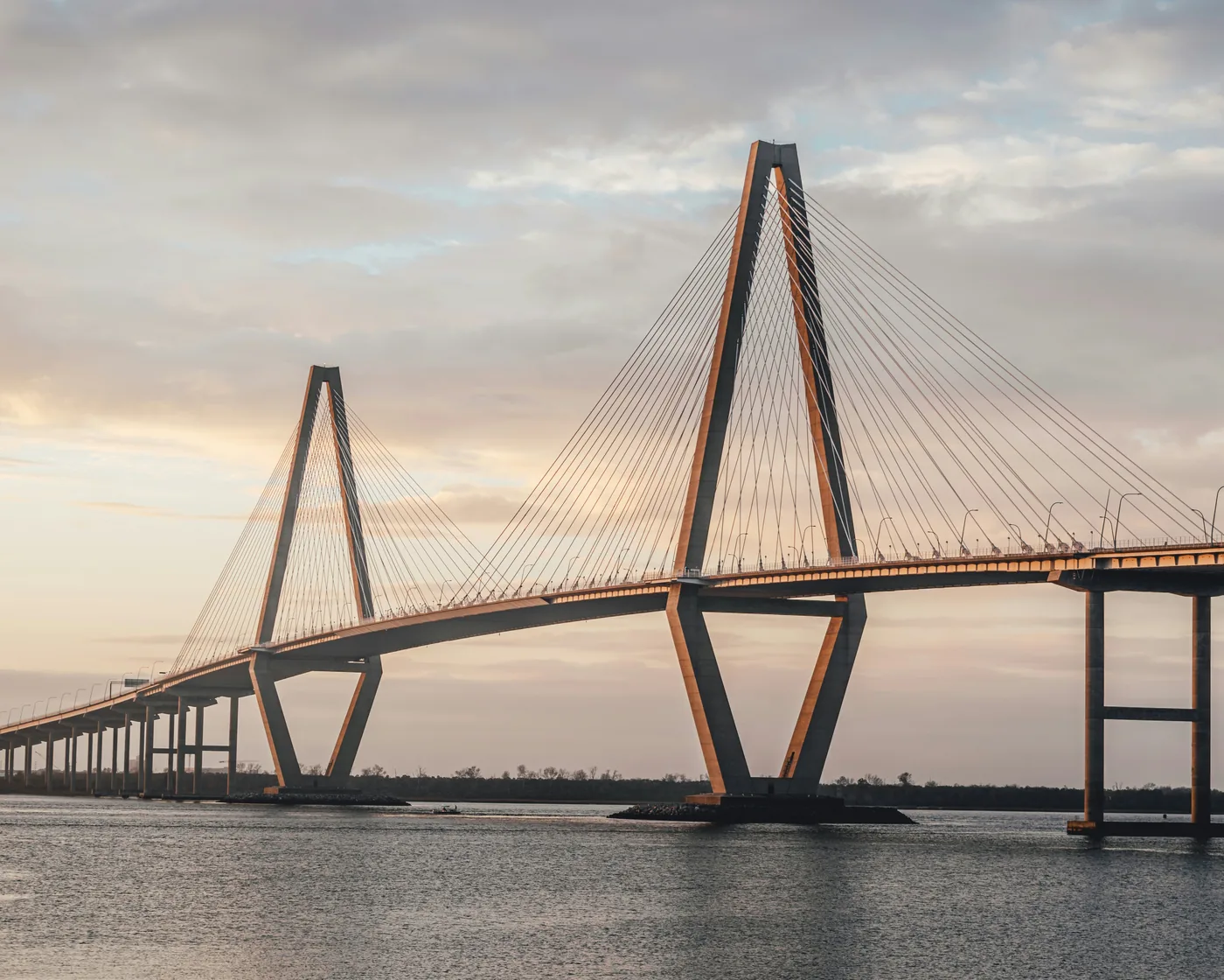 The Arthur Ravenel Jr. Bridge over the Cooper River near Charleston in soft evening light.