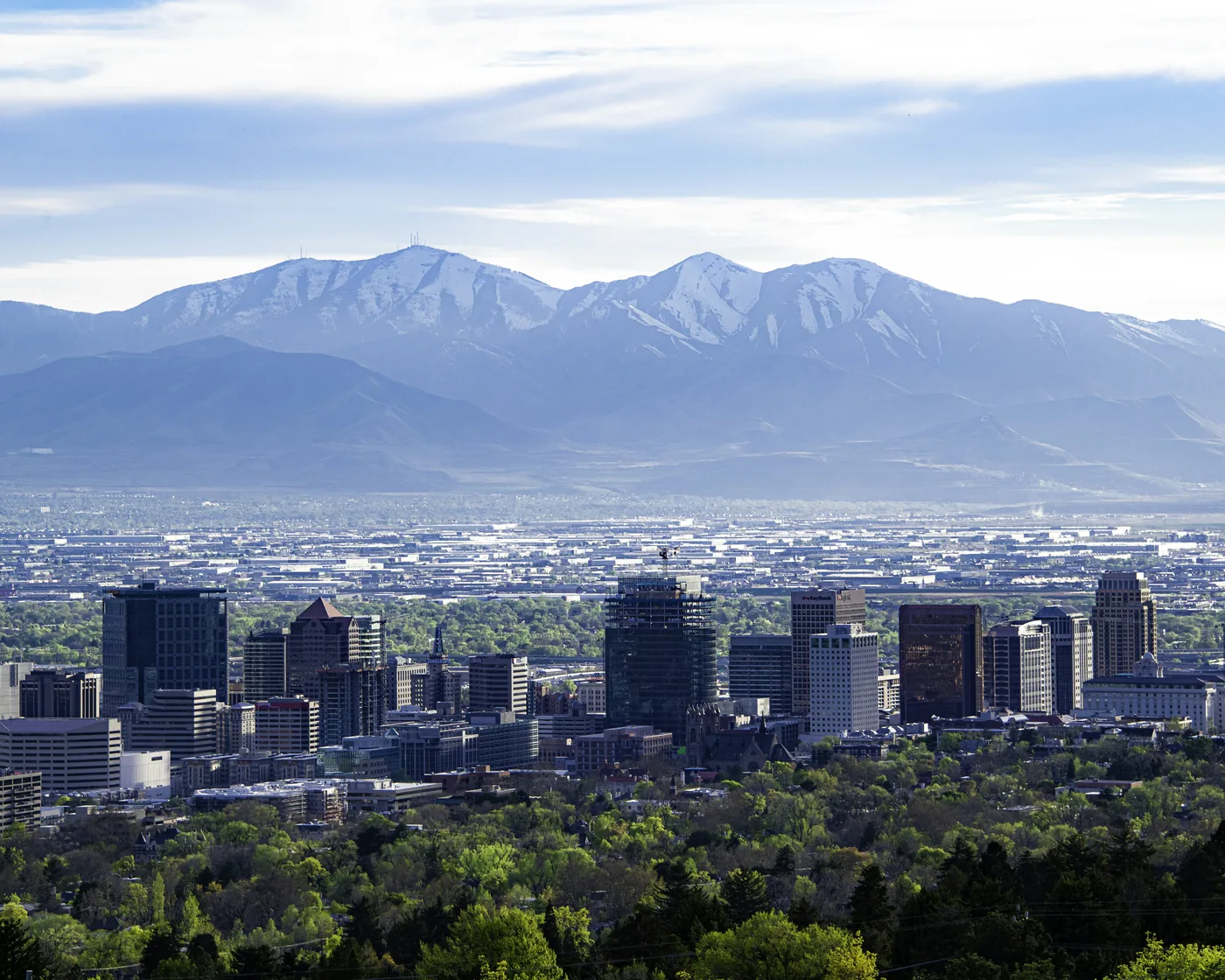 Downtown Salt Lake City in spring, with the Oquirrh Mountains behind, from the top of Virginia Street.